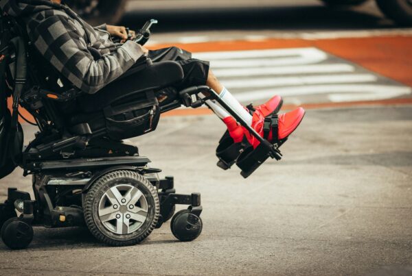 a person in a motorized wheelchair